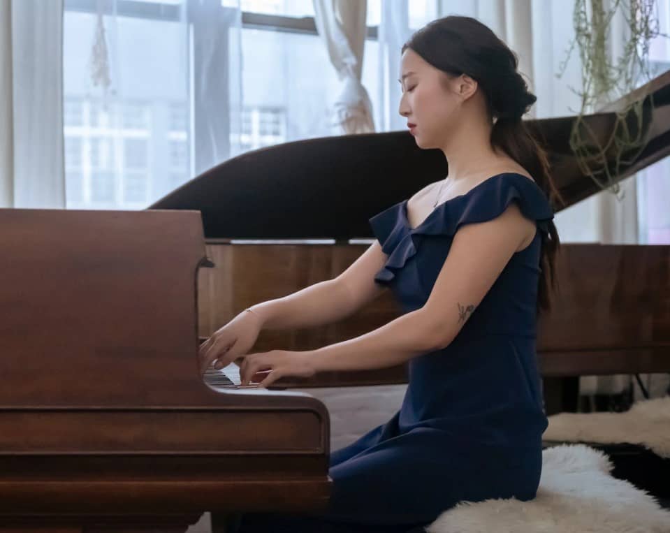 woman playing piano